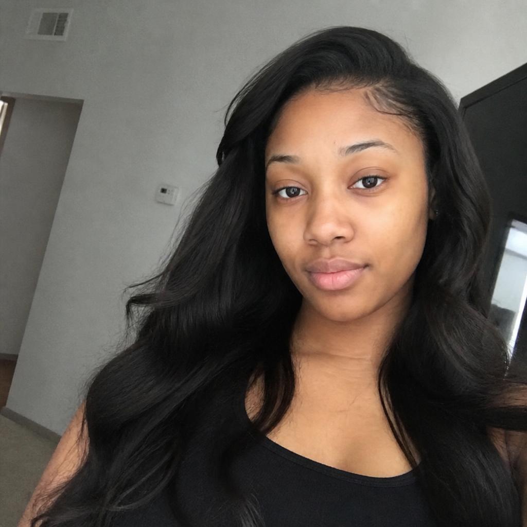Client with a closure wig install styled in soft waves